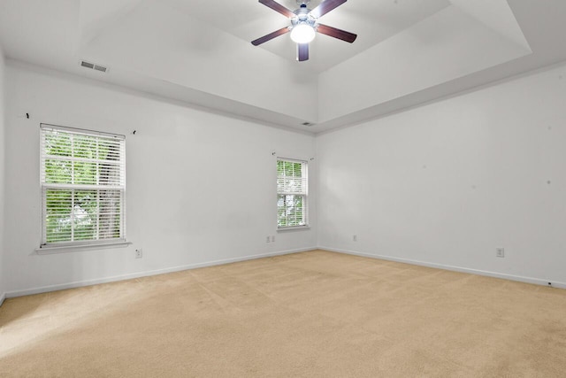 5404 Red Fork Ln, North Charleston, SC 29420 - empty room featuring light colored carpet, baseboards, a ceiling fan, and a raised ceiling