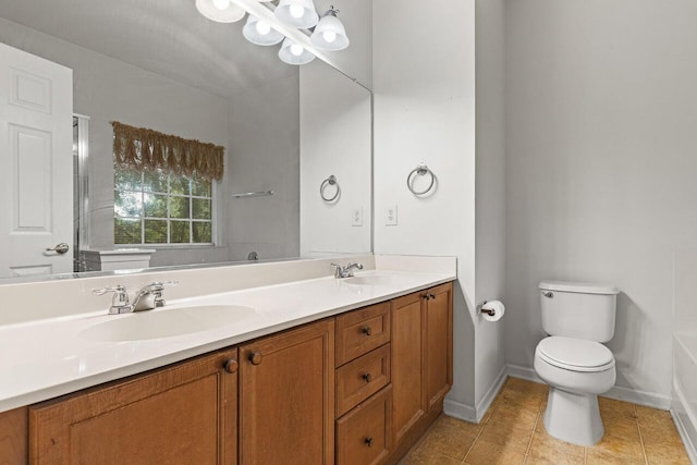 5404 Red Fork Ln, North Charleston, SC 29420 - bathroom with toilet, tile patterned flooring, baseboards, and double vanity