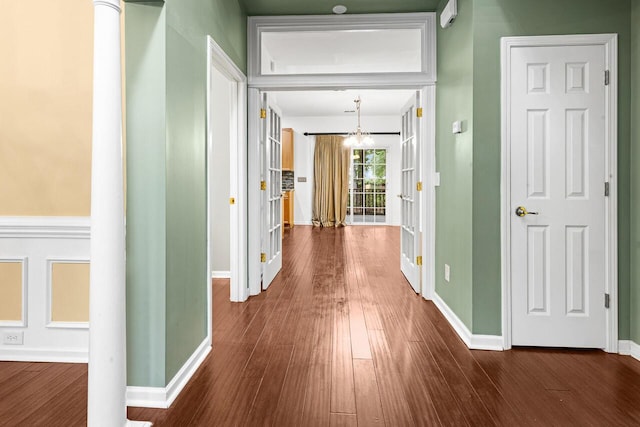 5404 Red Fork Ln, North Charleston, SC 29420 - hallway with a chandelier, baseboards, and dark wood-style flooring