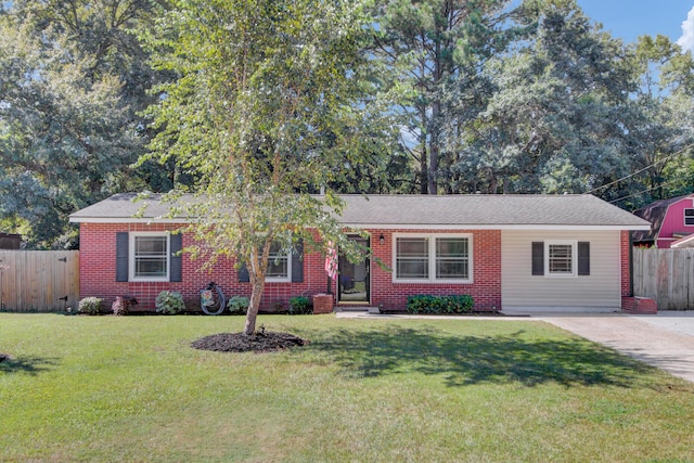 ranch-style home featuring a front yard