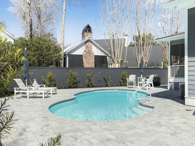 view of pool featuring a patio, fence, and a fenced in pool