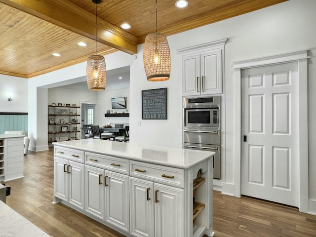 kitchen featuring wood finished floors, recessed lighting, pendant lighting, wooden ceiling, and beamed ceiling