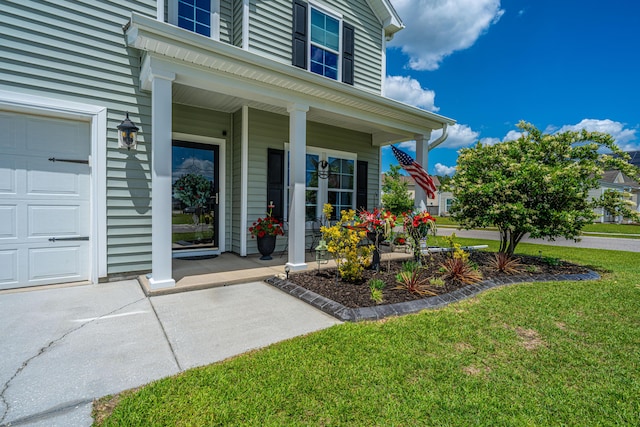 511 Nandina Dr, Goose Creek, SC 29445 - entrance to property with covered porch, a garage, and a lawn