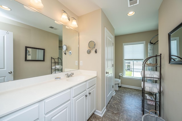 511 Nandina Dr, Goose Creek, SC 29445 - full bathroom with toilet, baseboards, vanity, and visible vents