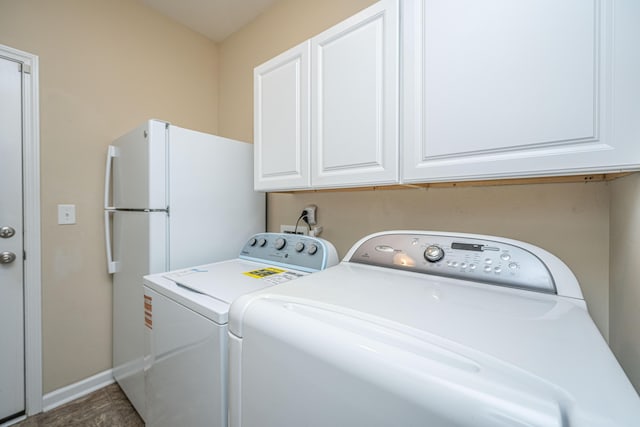 511 Nandina Dr, Goose Creek, SC 29445 - clothes washing area with baseboards, cabinet space, and washer and clothes dryer