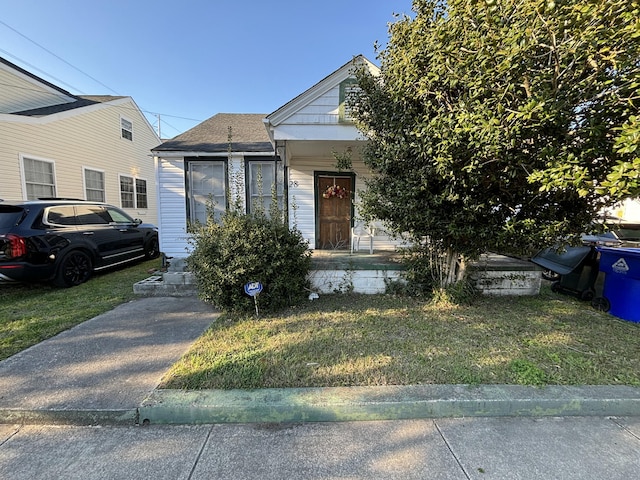 bungalow with a front yard