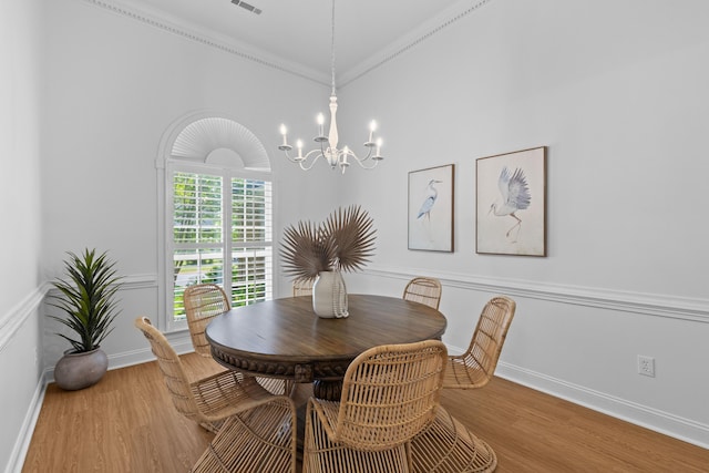 1441 Waterside Ct, Mount Pleasant, SC 29464 - dining room featuring a chandelier, wood finished floors, and crown molding