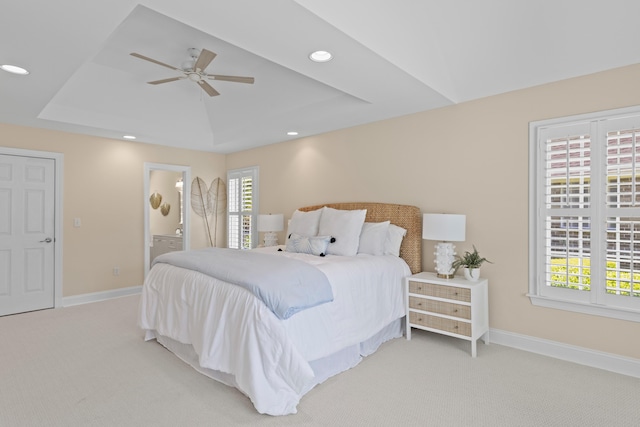 1441 Waterside Ct, Mount Pleasant, SC 29464 - bedroom with light colored carpet, a tray ceiling, recessed lighting, ensuite bath, and ceiling fan