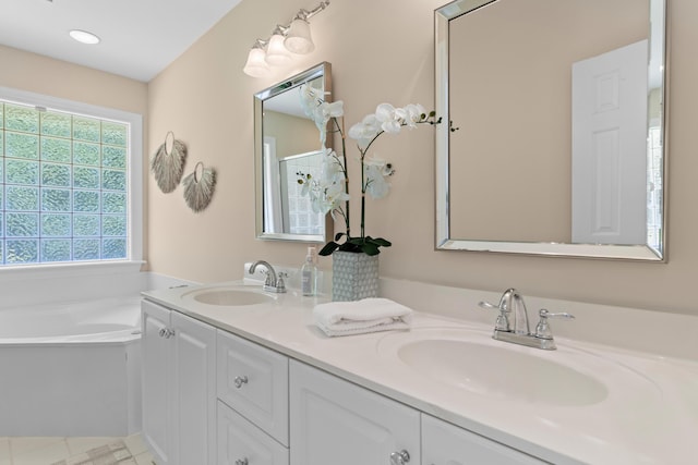 1441 Waterside Ct, Mount Pleasant, SC 29464 - full bath with double vanity, a bath, and recessed lighting