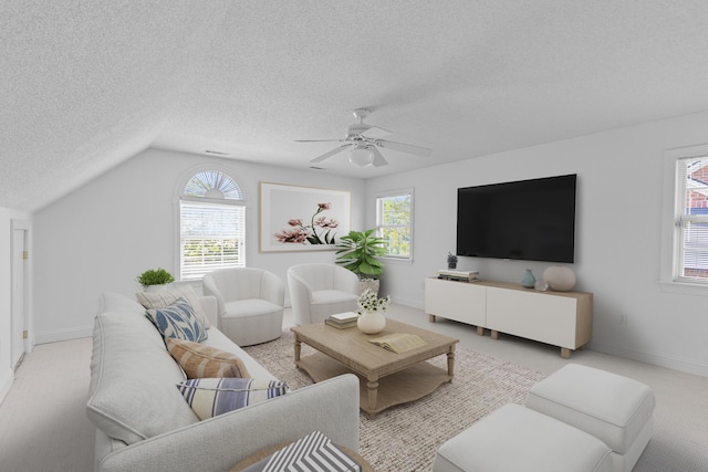 1441 Waterside Ct, Mount Pleasant, SC 29464 - living area with a textured ceiling, healthy amount of natural light, a ceiling fan, lofted ceiling, and light carpet