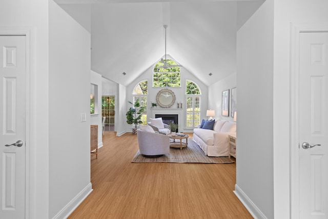 1441 Waterside Ct, Mount Pleasant, SC 29464 - living area featuring light wood-type flooring, a fireplace, and lofted ceiling