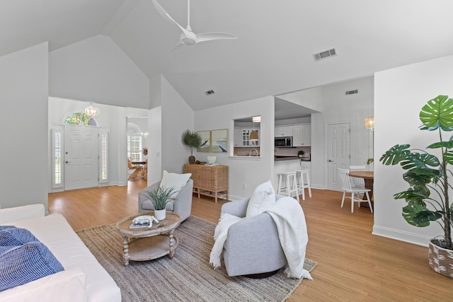 1441 Waterside Ct, Mount Pleasant, SC 29464 - living room with light wood-style floors, high vaulted ceiling, and ceiling fan