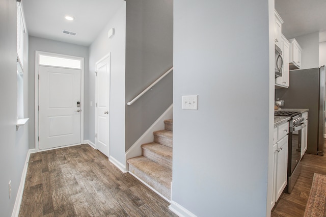 foyer featuring dark wood-type flooring