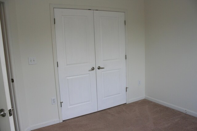 1755 Central Park Rd Unit 9103, Charleston, SC 29412 - unfurnished bedroom with carpet floors, a closet, and baseboards