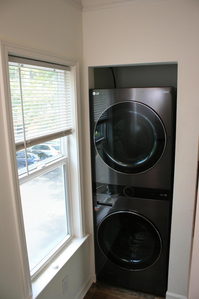 1755 Central Park Rd Unit 9103, Charleston, SC 29412 - washroom featuring stacked washing machine and dryer, dark wood-style flooring, and baseboards