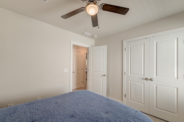 unfurnished bedroom featuring a closet and ceiling fan