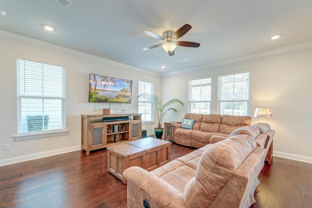 living room with ornamental molding, dark wood-type flooring, and ceiling fan