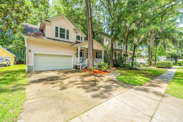 3005 Macbeth Creek Dr, Charleston, SC 29414 - view of front facade with a porch, concrete driveway, a front lawn, a garage, and roof with shingles