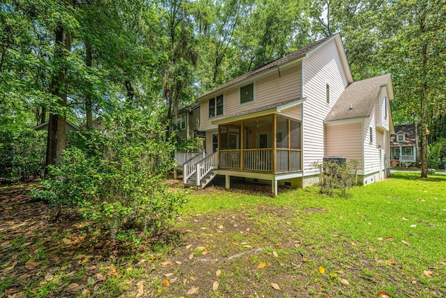 3005 Macbeth Creek Dr, Charleston, SC 29414 - back of house with a sunroom, a lawn, a shingled roof, and stairway