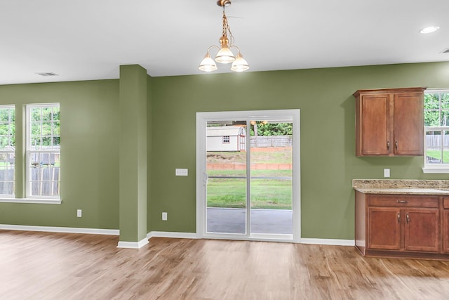 127 Rawlins Dr, Summerville, SC 29485 - unfurnished dining area with light wood-style floors and baseboards