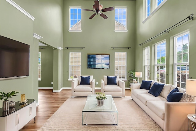 127 Rawlins Dr, Summerville, SC 29485 - living area featuring wood finished floors, a ceiling fan, and a towering ceiling