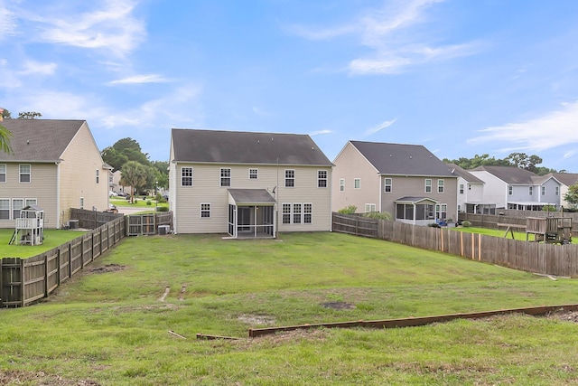 127 Rawlins Dr, Summerville, SC 29485 - rear view of house with a sunroom, a residential view, and a fenced backyard