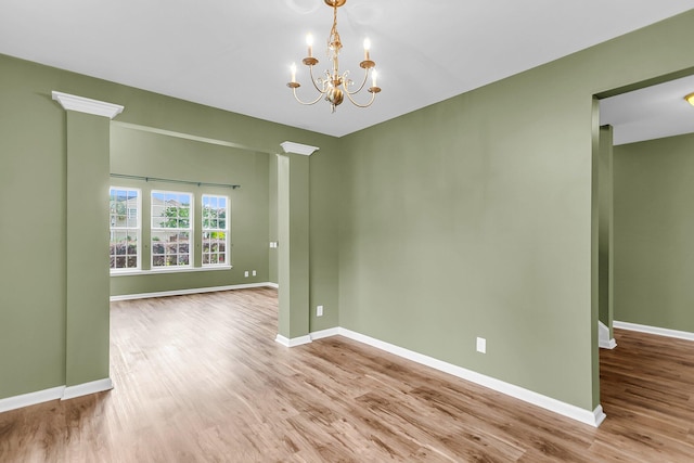 127 Rawlins Dr, Summerville, SC 29485 - spare room featuring wood finished floors and a chandelier
