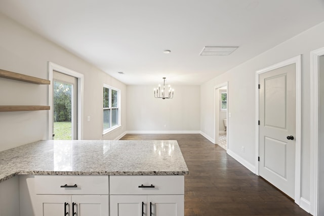 1506 Southwick Dr, Johns Island, SC 29455 - kitchen with a peninsula, a chandelier, dark wood-type flooring, and white cabinets