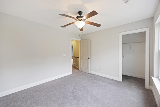 1506 Southwick Dr, Johns Island, SC 29455 - unfurnished bedroom with carpet flooring, baseboards, a closet, a walk in closet, and a ceiling fan