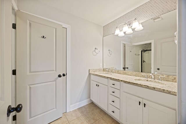1506 Southwick Dr, Johns Island, SC 29455 - full bath featuring double vanity, tile patterned floors, an enclosed shower, and baseboards