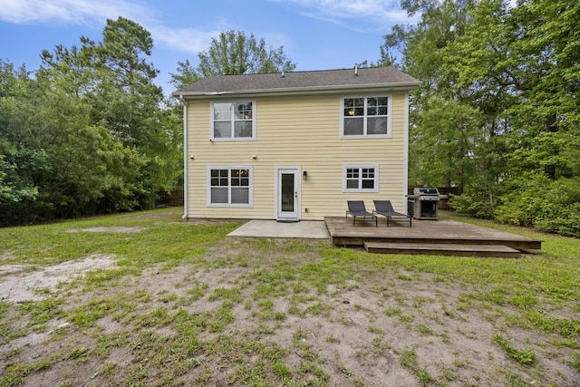 1506 Southwick Dr, Johns Island, SC 29455 - rear view of house with a deck, a lawn, and a patio