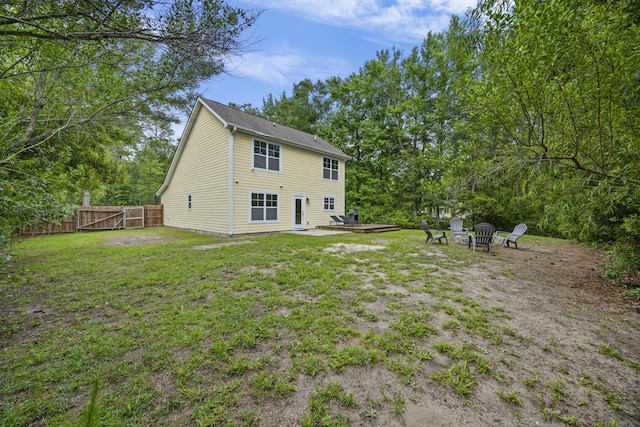 1506 Southwick Dr, Johns Island, SC 29455 - rear view of property with a fire pit, a gate, and a patio