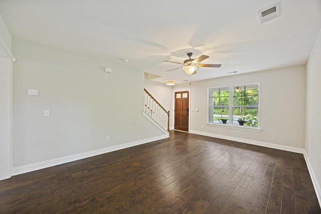 1506 Southwick Dr, Johns Island, SC 29455 - unfurnished living room featuring ceiling fan, stairs, dark wood finished floors, and baseboards
