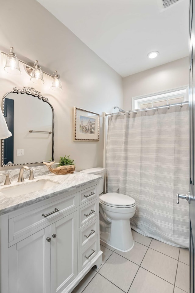 116 W 2nd St, Folly Beach, SC 29439 - bathroom with tile patterned floors, vanity, toilet, and a shower with curtain