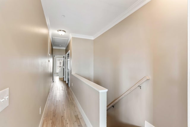 116 W 2nd St, Folly Beach, SC 29439 - hall featuring an upstairs landing, ornamental molding, attic access, light wood-style floors, and baseboards