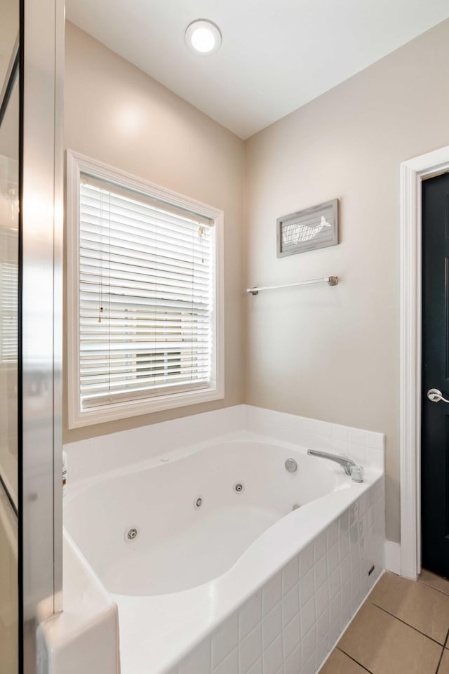 116 W 2nd St, Folly Beach, SC 29439 - full bath featuring tile patterned floors and a whirlpool tub