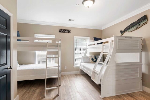 116 W 2nd St, Folly Beach, SC 29439 - bedroom featuring ornamental molding, wood finished floors, and baseboards