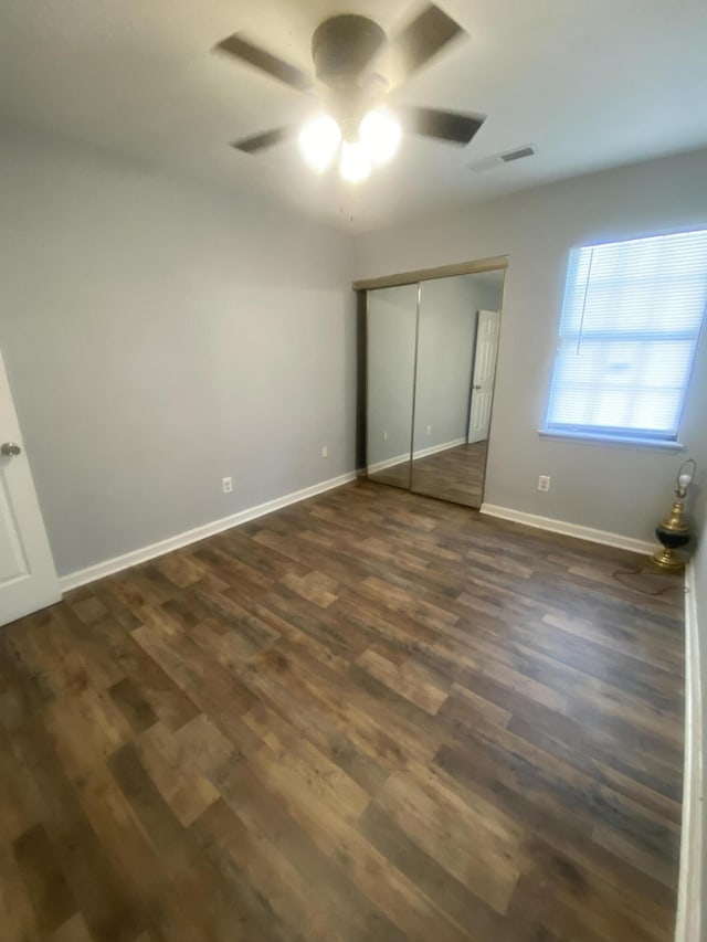 8254 Timberidge Ct, North Charleston, SC 29420 - unfurnished bedroom featuring dark wood-style floors, a closet, and a ceiling fan