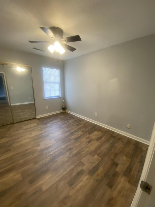 8254 Timberidge Ct, North Charleston, SC 29420 - unfurnished bedroom featuring dark wood-style flooring, a closet, and a ceiling fan