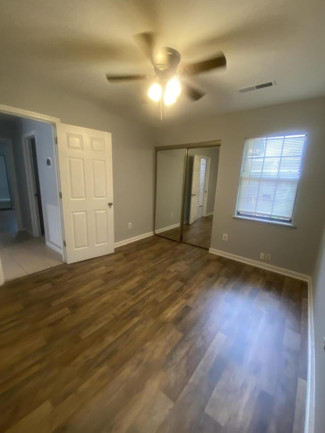 8254 Timberidge Ct, North Charleston, SC 29420 - unfurnished bedroom with wood finished floors, a closet, and ceiling fan