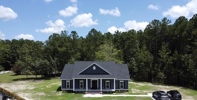 country-style home featuring a front yard and a porch