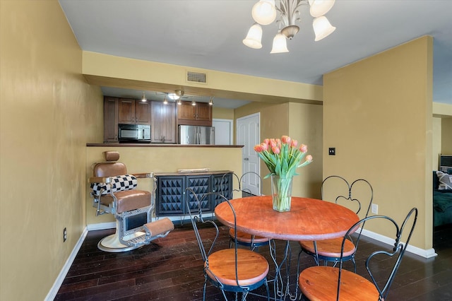 dining space with a notable chandelier, visible vents, baseboards, and dark wood-style flooring