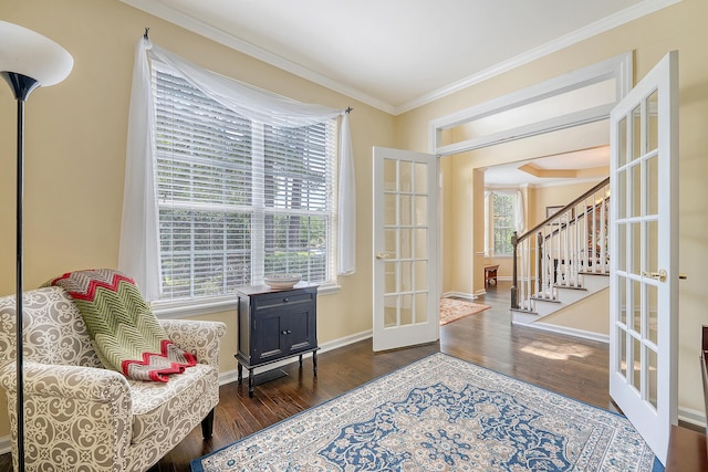 entrance foyer featuring french doors, wood finished floors, ornamental molding, stairs, and baseboards