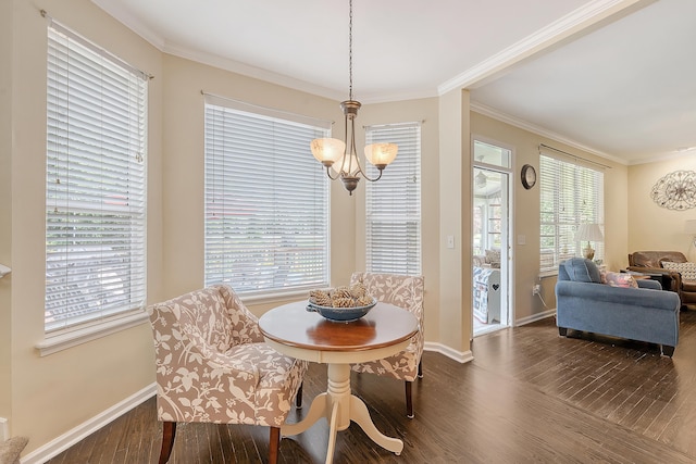 dining space with dark wood-type flooring, a chandelier, plenty of natural light, baseboards, and ornamental molding