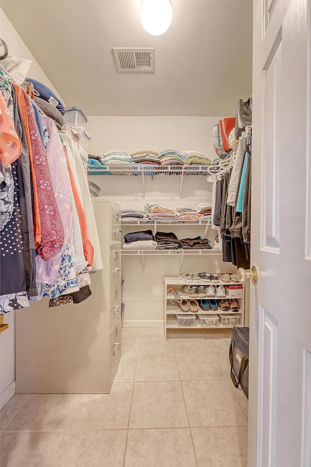 spacious closet featuring tile patterned floors
