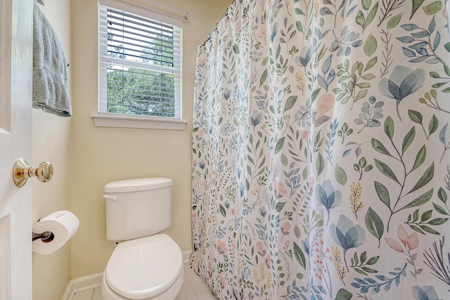 full bath with tile patterned floors, toilet, baseboards, and a shower with shower curtain