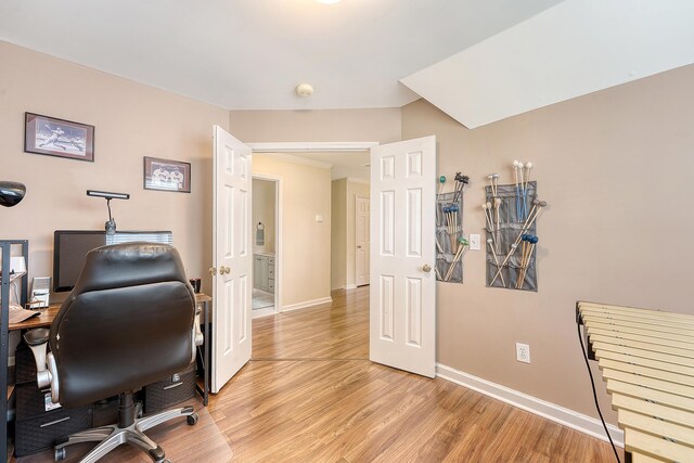 office area with light wood-type flooring and baseboards