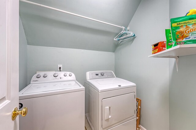 laundry room with washing machine and clothes dryer