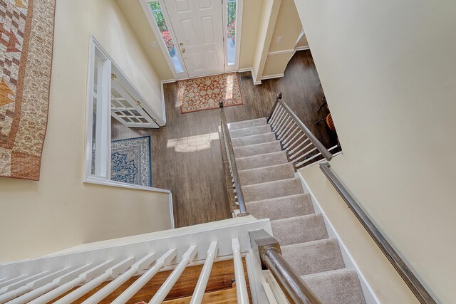 stairs with wood finished floors