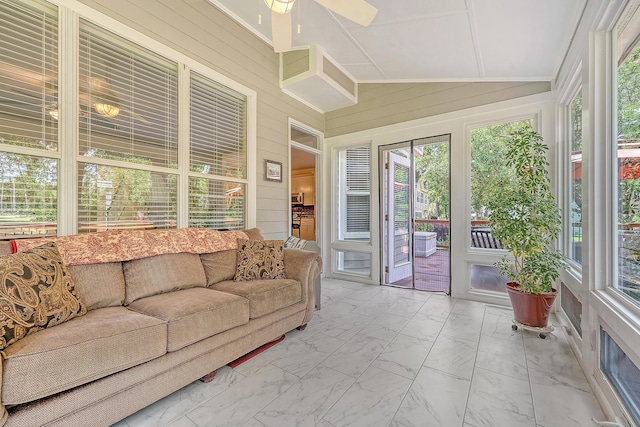 sunroom featuring an outdoor living space, a ceiling fan, and vaulted ceiling